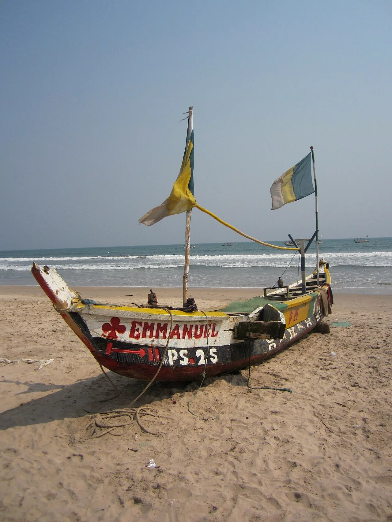 Image description: A colorful fishing boat on Kokrobite Beach, Ghana.